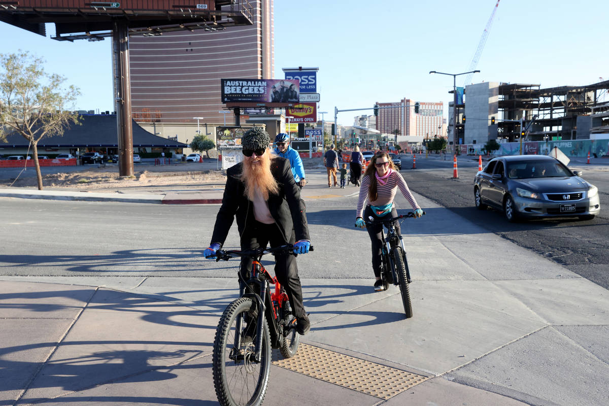 Las Vegas resident and ZZ Top frontman Billy Gibbons rides up the Strip in Las Vegas with his w ...