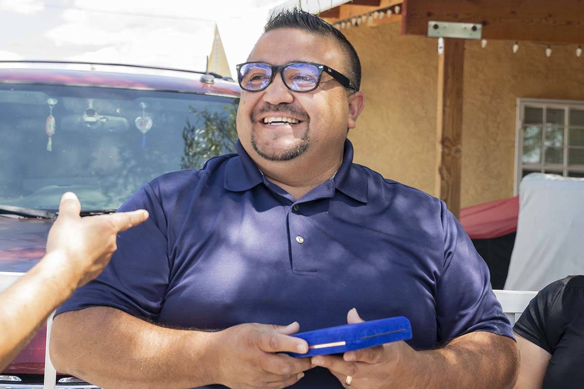 Jose Alvarado holds a medal he received from the North Las Vegas Fire department on Wednesday, ...