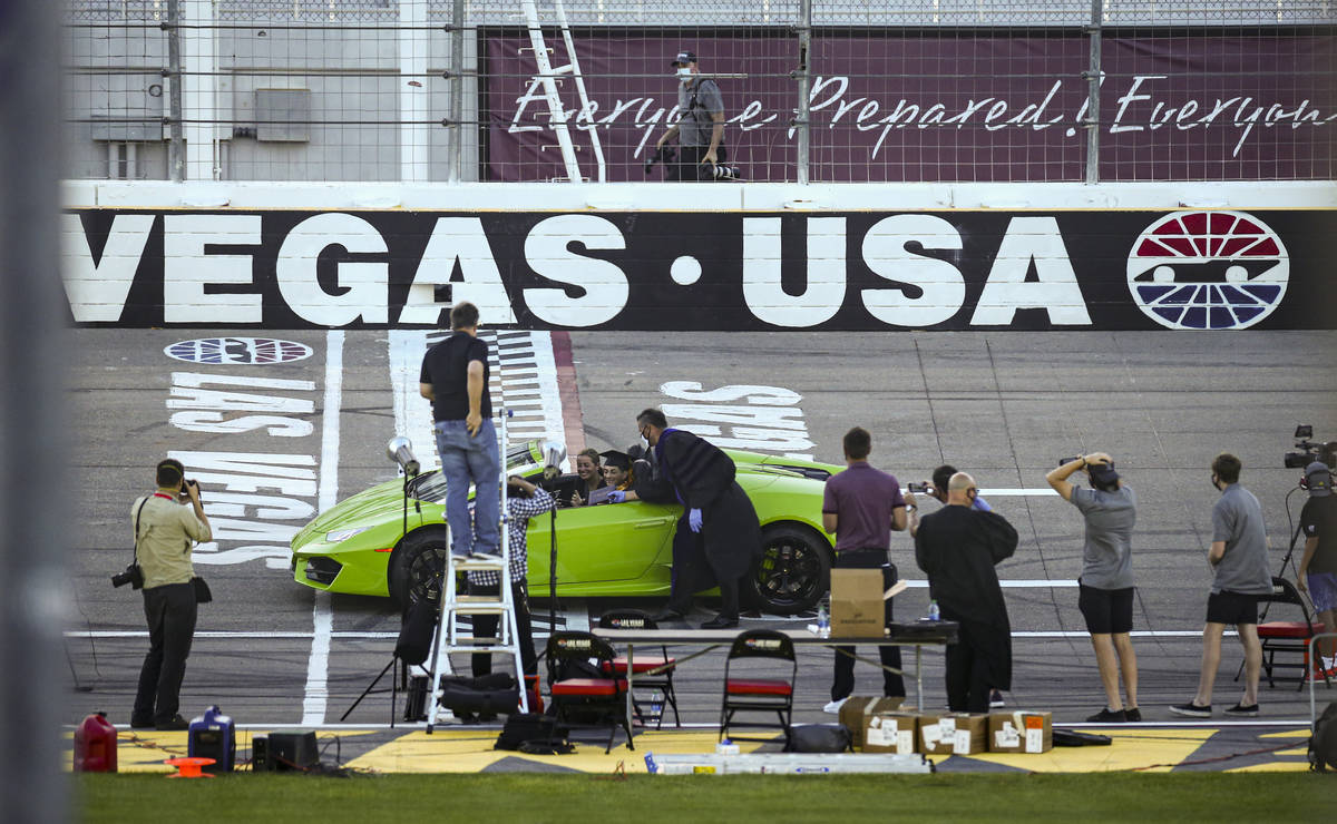 A Faith Lutheran High School student drives a Lamborghini during a graduation ceremony at Las V ...