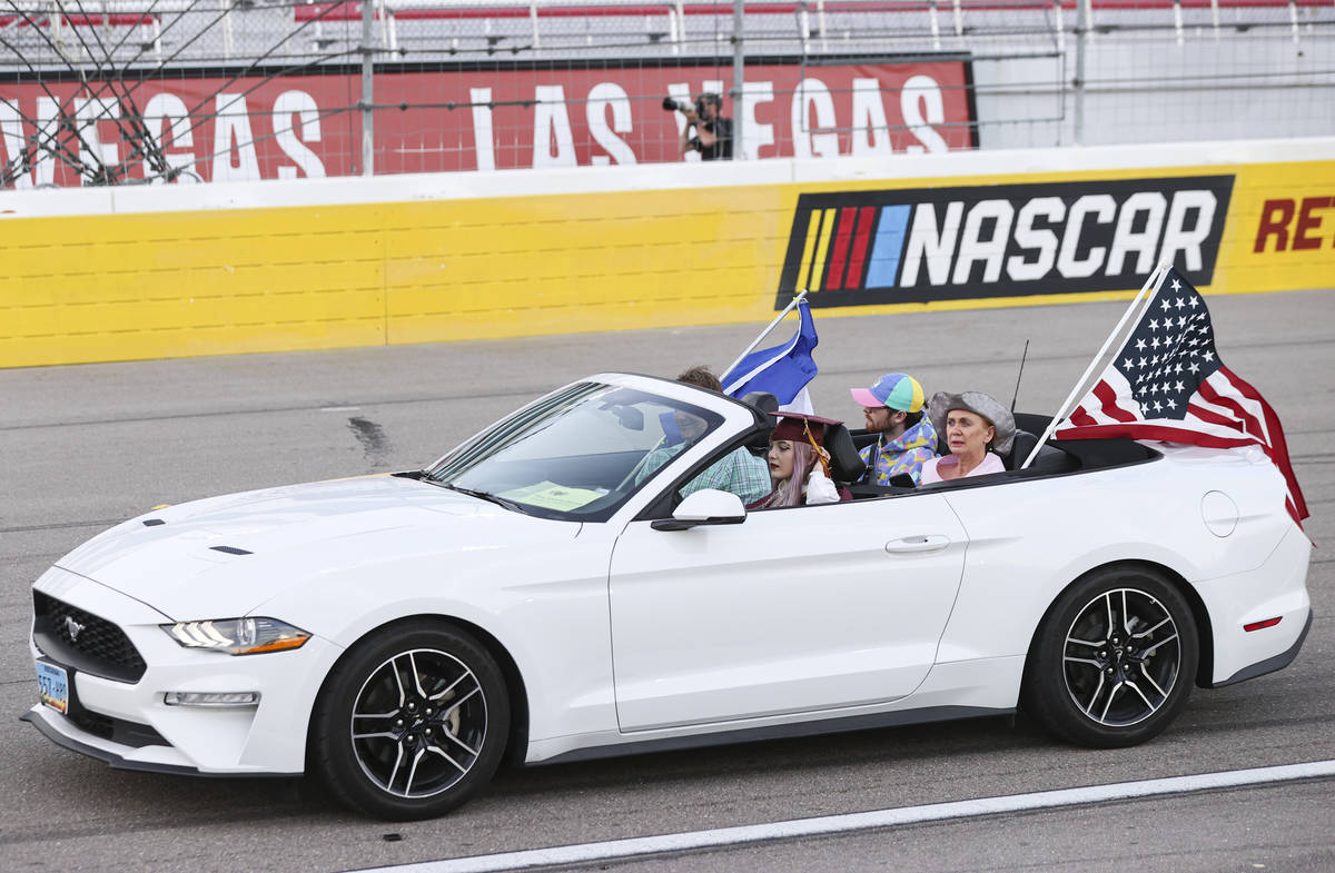 Faith Lutheran High School student Elise-Adelaide Hamann drives while participating in a gradua ...
