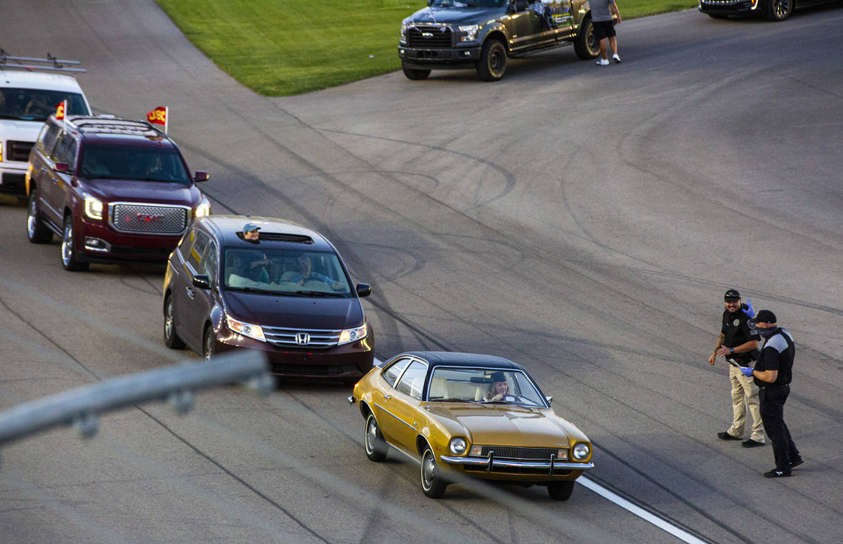 A Faith Lutheran High School student approaches the start/finish line for their diploma during ...