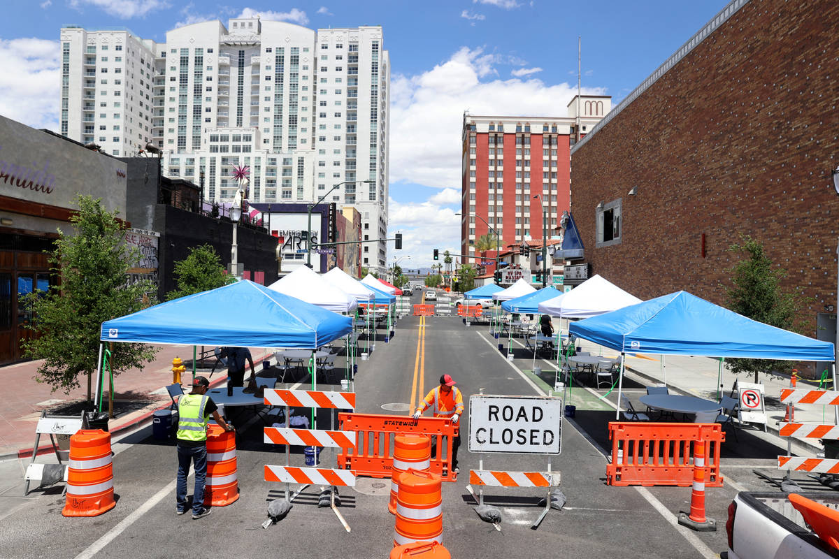 Eric Maldonado, left, and Ray Sandoval with of Work Zone Traffic Services, Inc. close 6th Stree ...