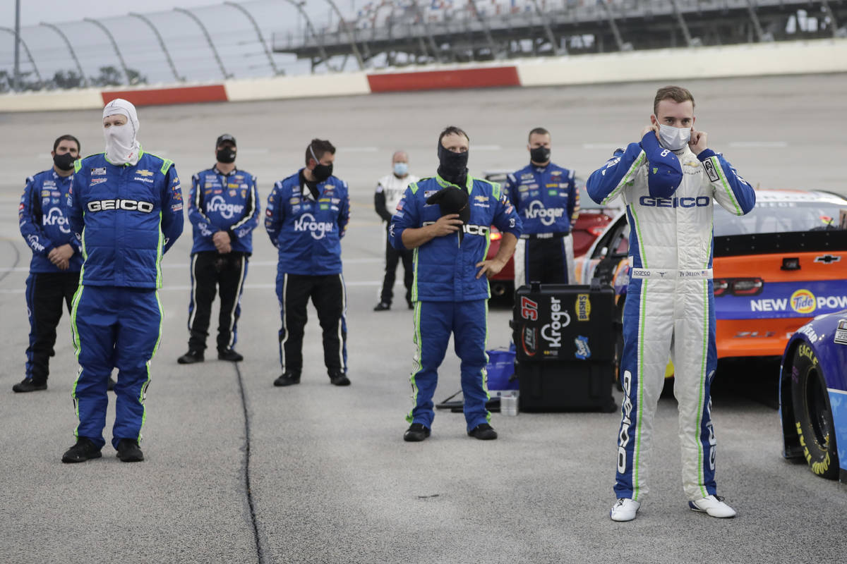 CORRECTS THE STATE TO S.C. - Driver Ty Dillon, right, stands for the national anthem before the ...