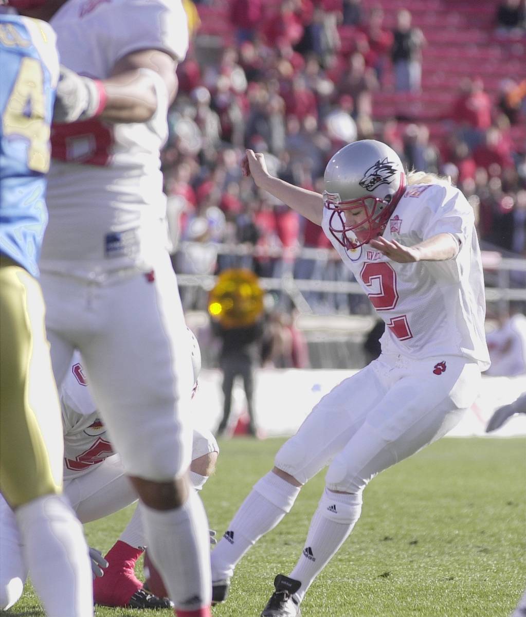Katie Hnida, a place-kicker for New Mexico, attempts an extra point during the first quarter We ...