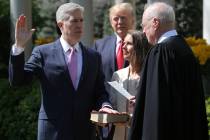 FILE PHOTO: Judge Neil Gorsuch (L) is sworn in as an associate justice of the Supreme Court by ...