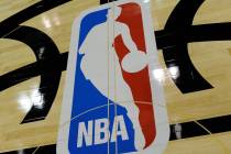 The NBA logo is displayed on the court inside the Thomas & Mack Center on Monday, July 8, 2 ...