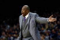 In this Saturday, Jan. 11, 2020, file photo, Georgetown head coach Patrick Ewing yells to his t ...