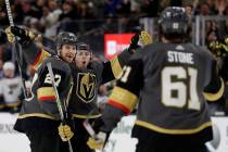 Vegas Golden Knights center Jonathan Marchessault, rear, celebrates after scoring against the S ...