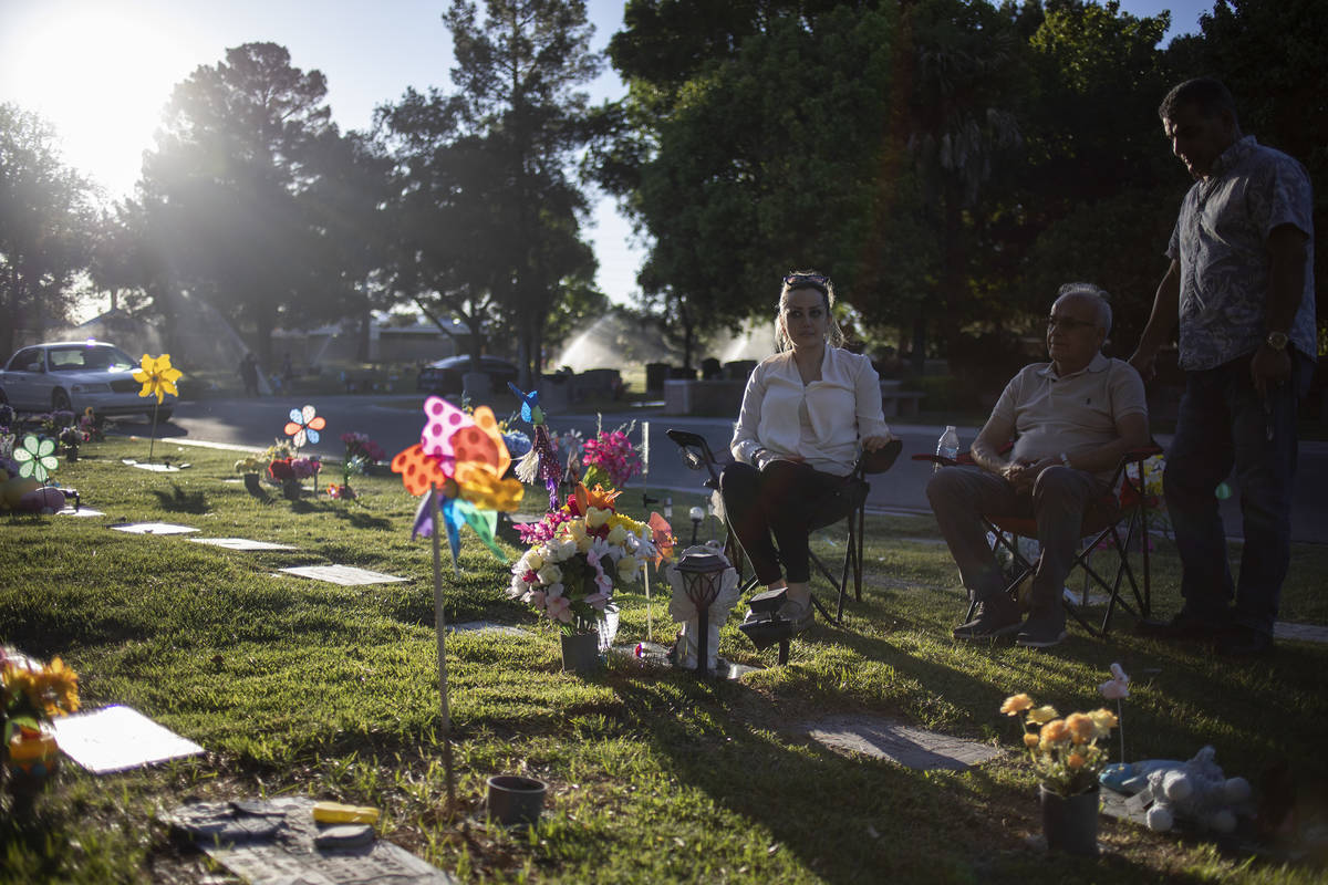 Dorsa Mehrvarz, left, her father Michael Mehrvarz, center, and her husband, Bobby Kosaryan, pay ...