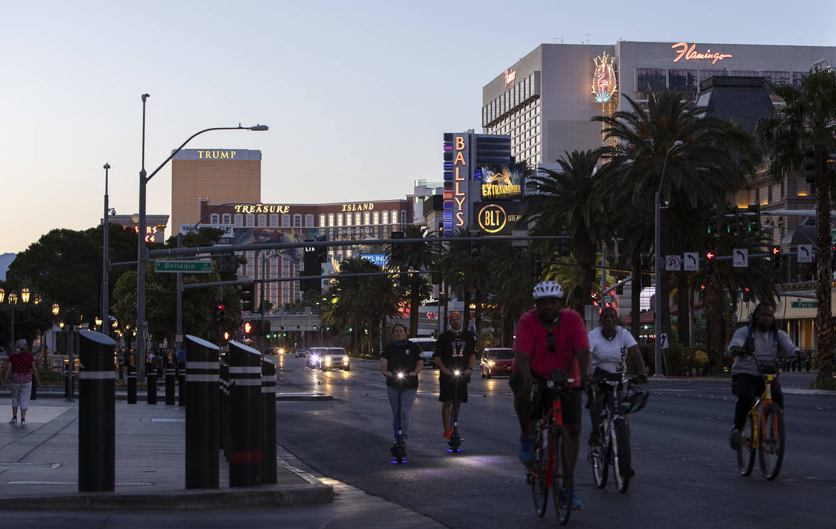 Bikers pedal down Las Vegas Boulevard on the Strip during Memorial Day weekend on Saturday, May ...