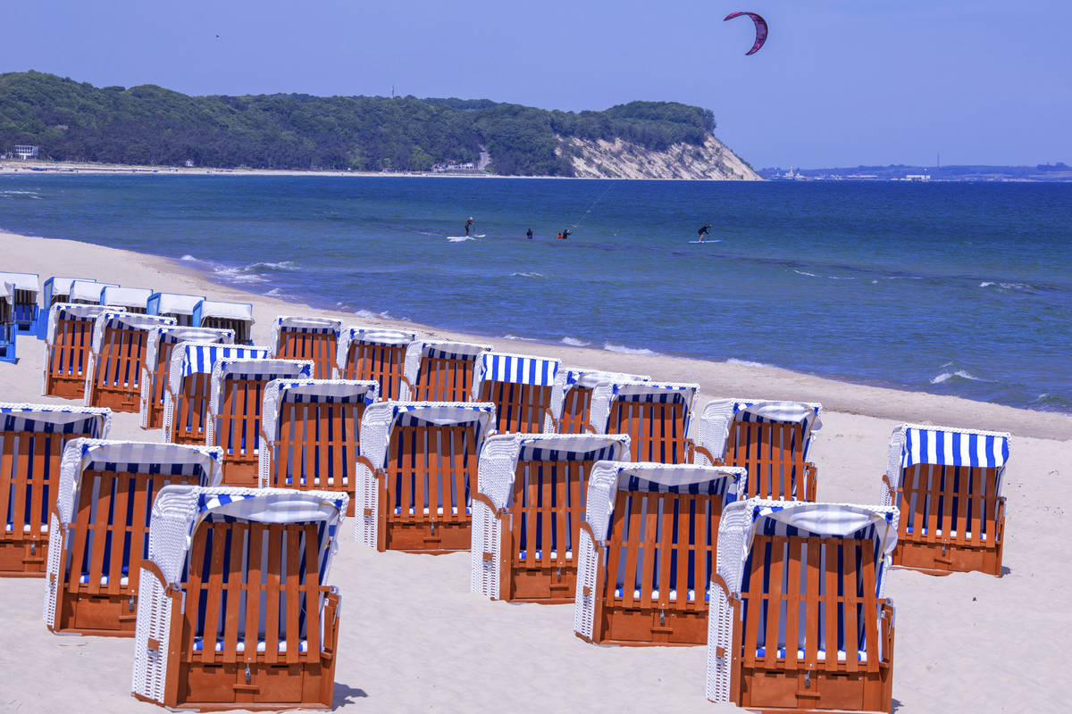 Chairs stand with the prescribed safety distance on a beach of G'hren on the island of R'gen, M ...
