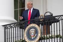 President Donald Trump points during a "Rolling to Remember Ceremony," to honor the n ...