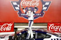 Brad Keselowski celebrates after winning the NASCAR Cup Series auto race at Charlotte Motor Spe ...