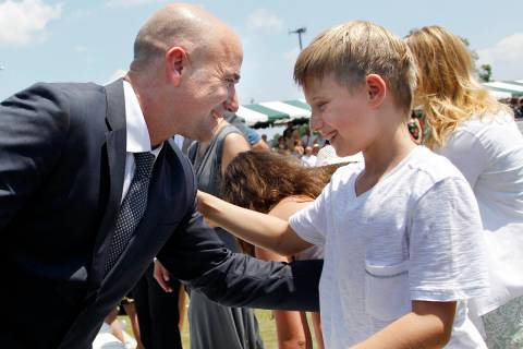 Tennis great Andre Agassi greets his son, Jaden, 9, after being inducted to the International T ...