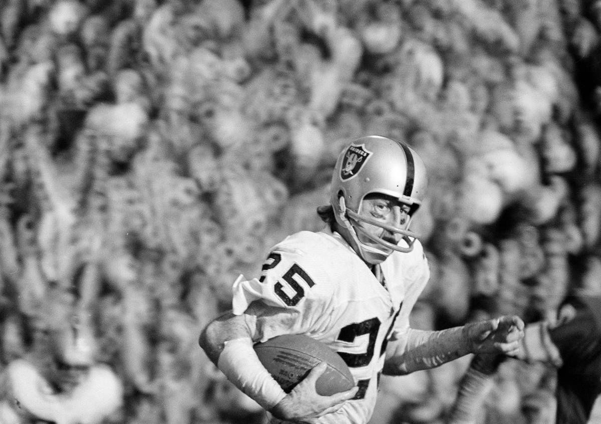 Wide receiver Fred Biletnikoff (25) of the Oakland Raiders rambles with one of the four passes ...