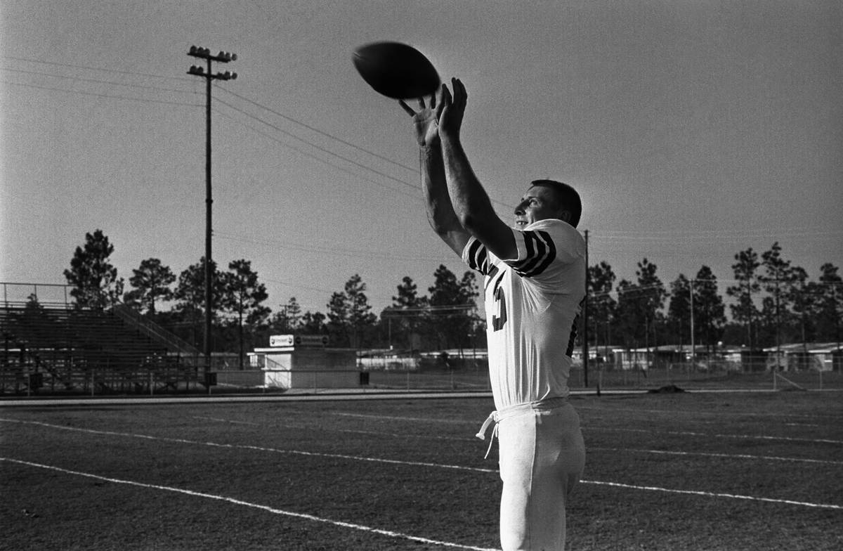 Circa 1970's: Fred Biletnikoff of the Oakland Raiders applying stickum  liberally to his foreram as well as other parts of his uniform as you can  see by the locations of grass stuck