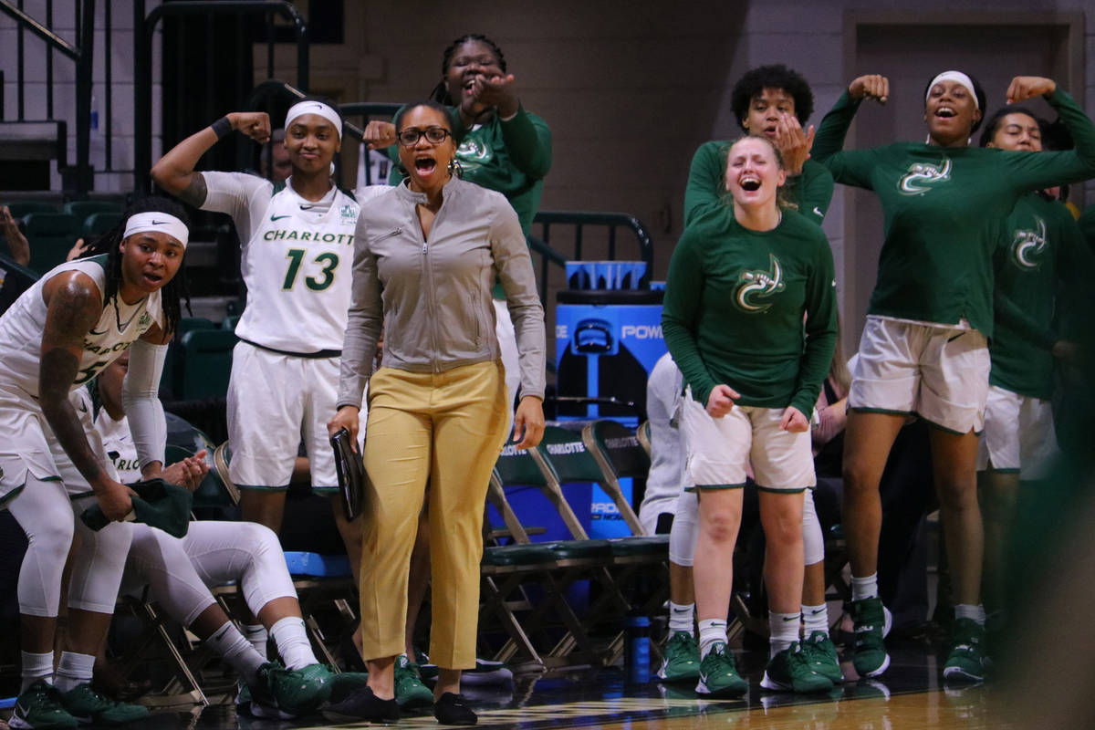 Charlotte women’s basketball head coach Tanisha Wright cheers with her team. (Eric Besserman)