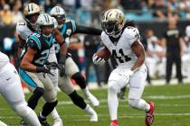 New Orleans Saints running back Alvin Kamara (41) runs against the Carolina Panthers during the ...