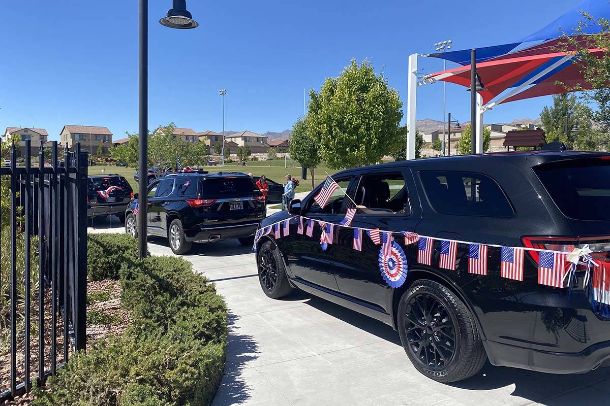 Cars line up to take part in Skye Canyon’s inaugural Patriotic Car Parade in northwest L ...