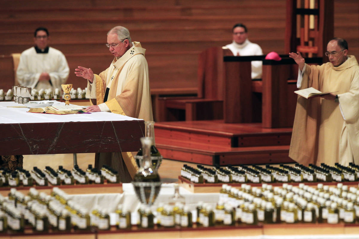 FILE - In this April 6, 2020 file photo, Los Angeles Archbishop Jose H. Gomez, front, celebrate ...