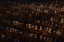 Crosses mark the graves of those who have passed away since early April, filling a new section ...