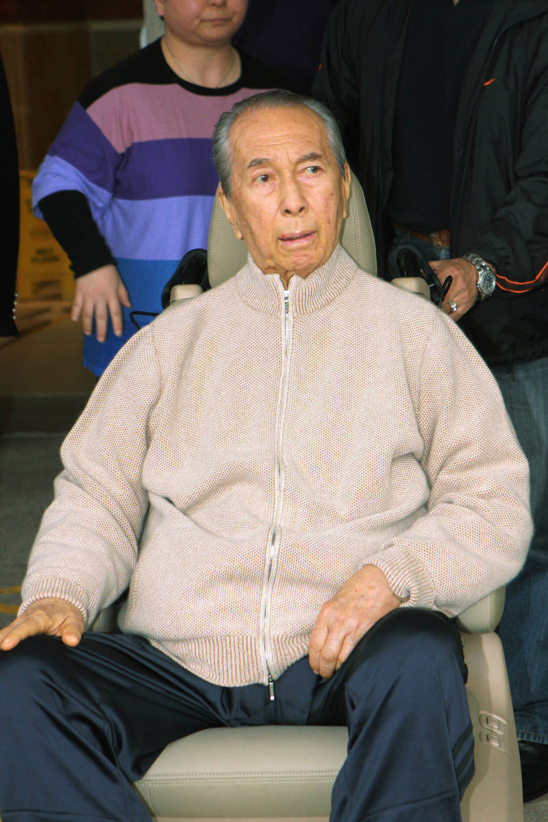 Casino mogul Stanley Ho is wheeled out of a Hong Kong hospital, March 6, 2010. On Tuesday, May ...
