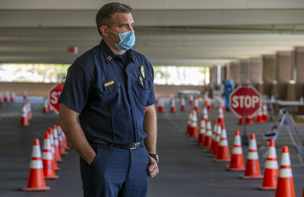 Clark County Fire Captain Brian OÕNeal stands by during a media briefing followed by a wal ...