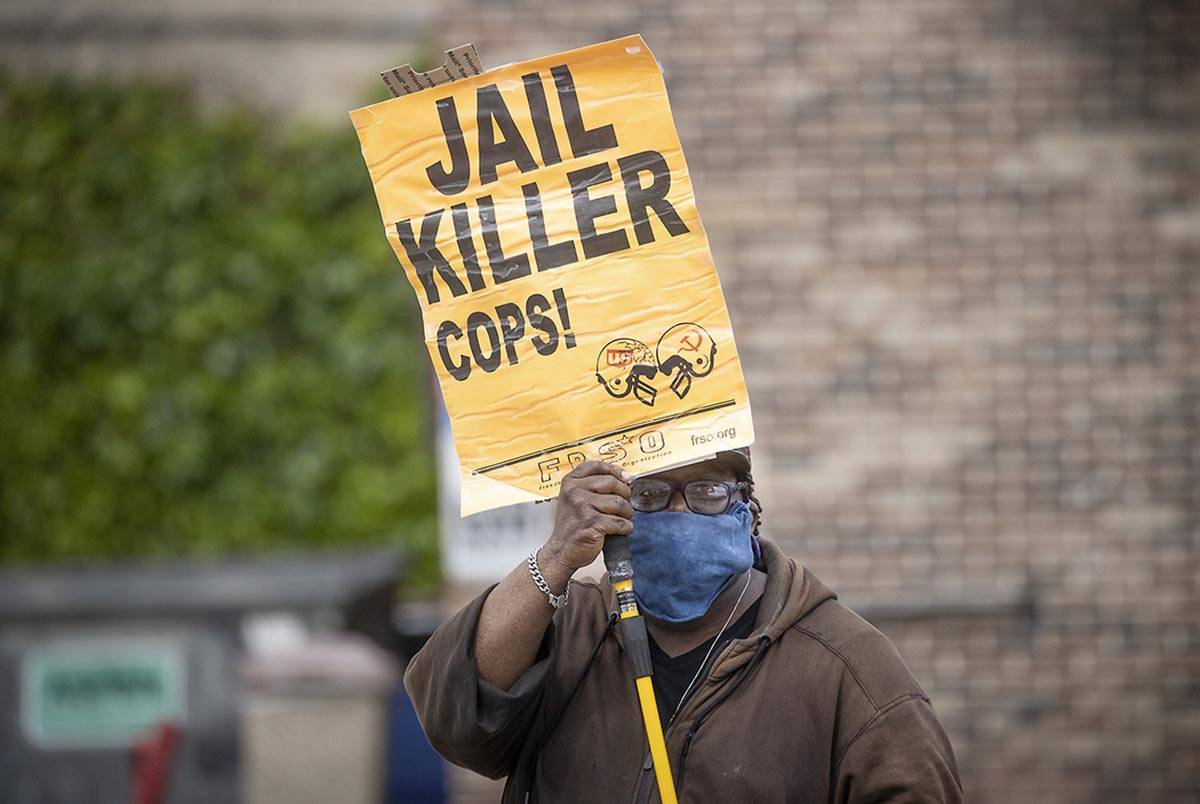 Steven Hudson protests, Tuesday, May 26, 2020, in Minneapolis, near the site where a black man, ...