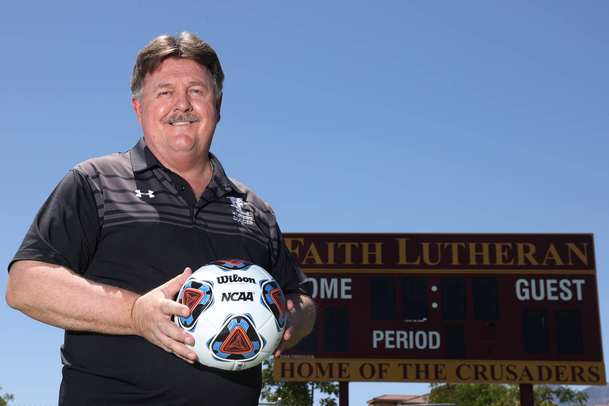 Bob Chinn, head coach of the Faith Lutheran girl's varsity team, poses for a photo at Faith Lut ...