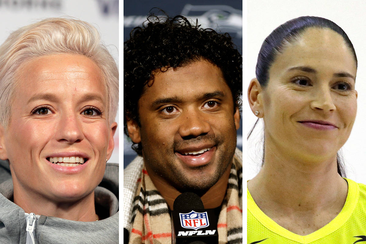 Soccer star Megan Rapinoe, from left, Seahawks quarterback Russell Wilson and three-time WNBA c ...