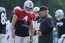 Oakland Raiders quarterback Derek Carr (4) and head coach Jon Gruden have a conversation after ...