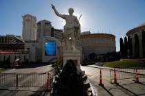Gates block an entrance to Caesars Palace hotel and casino along the Las Vegas Strip devoid of ...