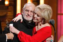 FILE -This June 12, 2011 file photo shows Larry Kramer, left, and Daryl Roth embracing after th ...