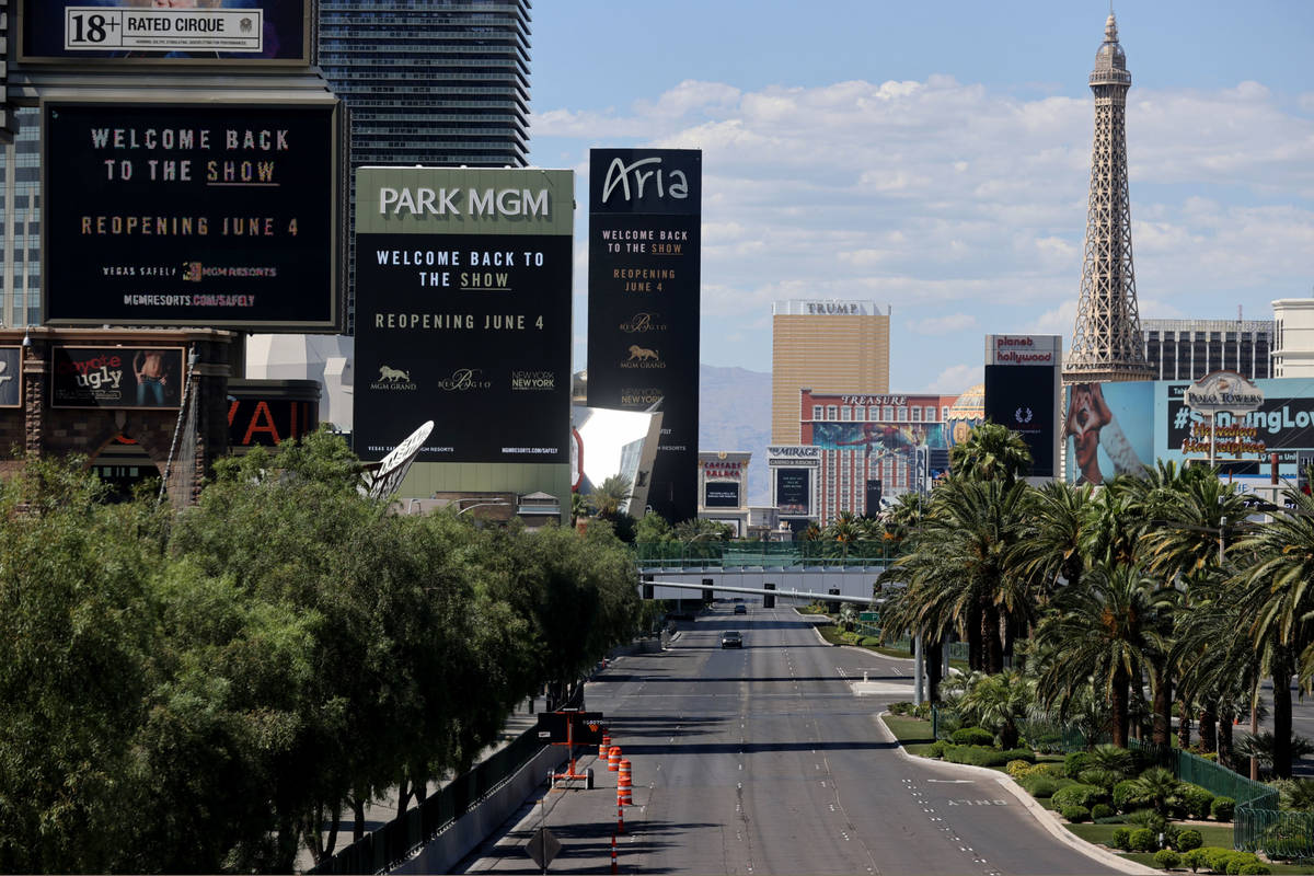 Marquees for MGM Resorts International properties on the Strip in Las Vegas, including from lef ...