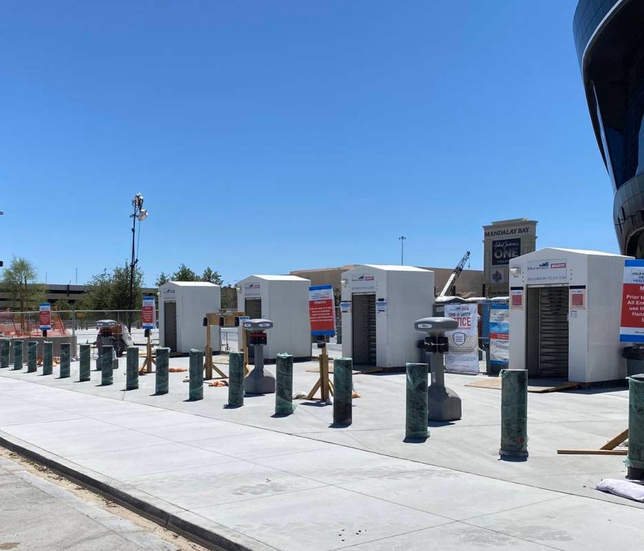 Hand sanitizer stations sit just outside the worker entry gates on the north end of Allegiant S ...