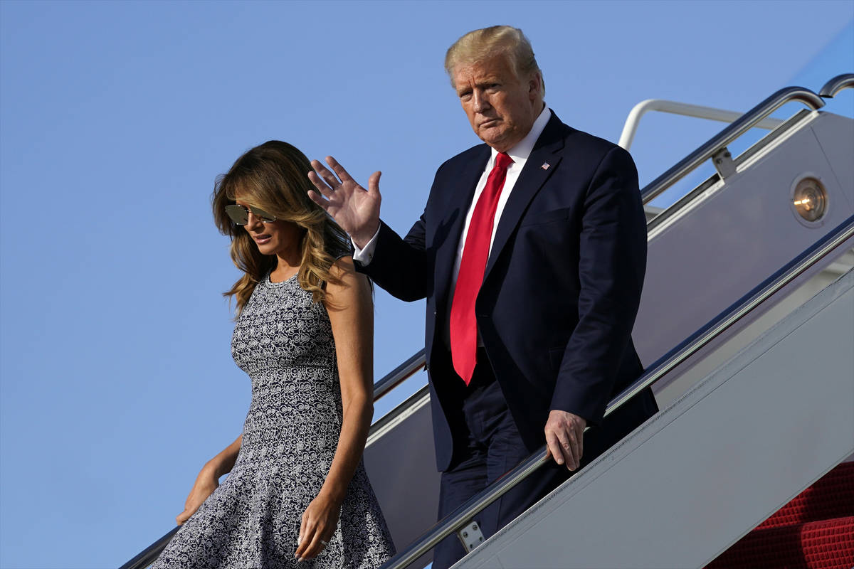 President Donald Trump and first lady Melania Trump arrive at Andrews Air Force Base, Md., Wedn ...