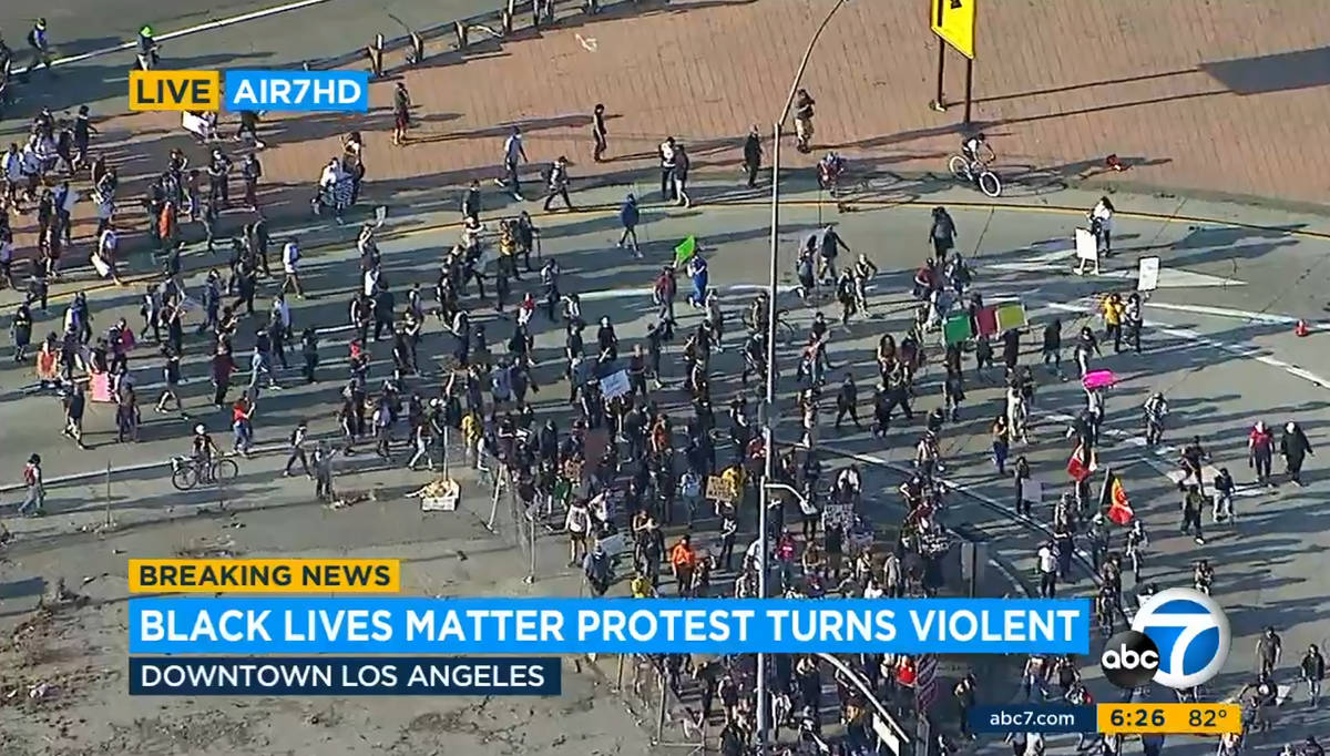 This image provided by KABC-TV shows Black Lives Matter protesters blocking a freeway in downto ...