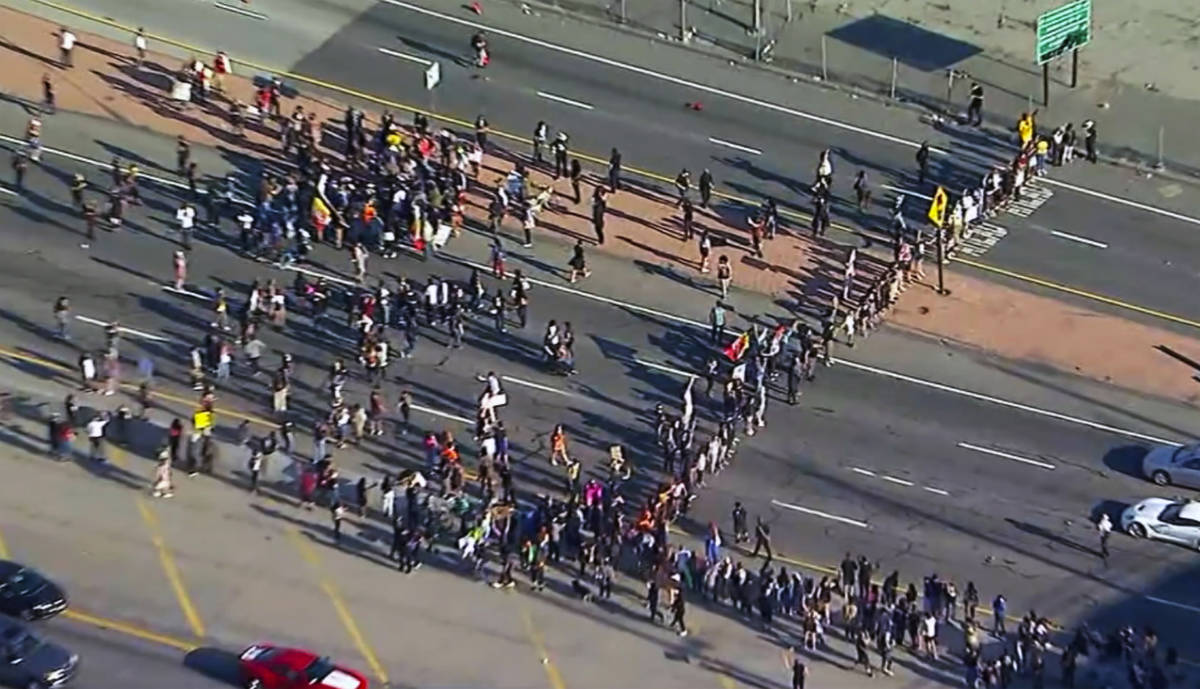 This aerial image provided by KABC-TV shows Black Lives Matter protesters blocking a freeway in ...