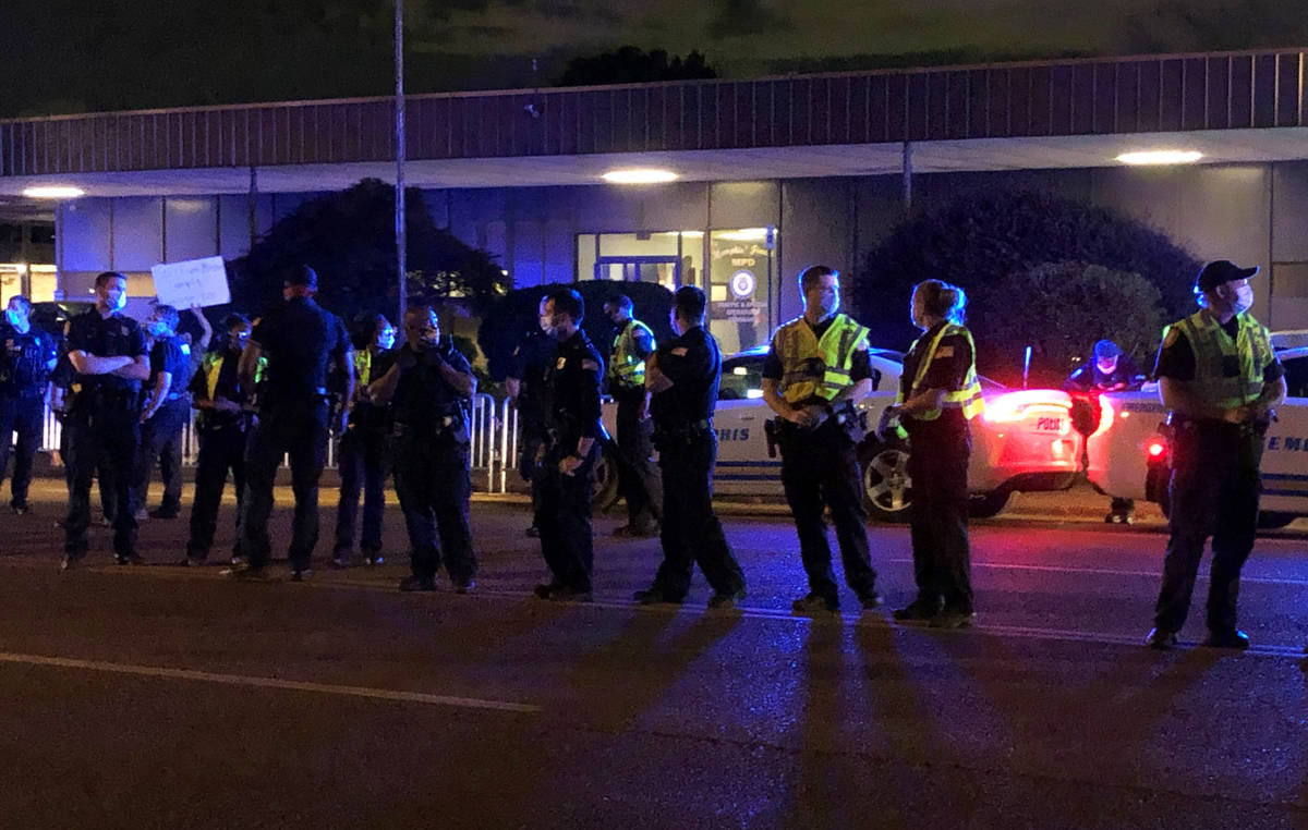 Officers form a line in front of a police precinct Wednesday, May 27, 2020, in Memphis, Tenn., ...