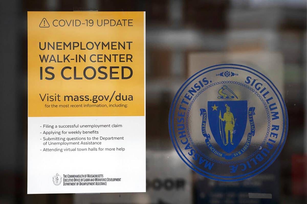 A sign announces the closure of the Massachusetts Unemployment Office, Saturday, May 9, 2020, i ...