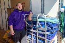 Carlos Ibarra, Move 4 Less team member, is ready to help four local families through the compan ...