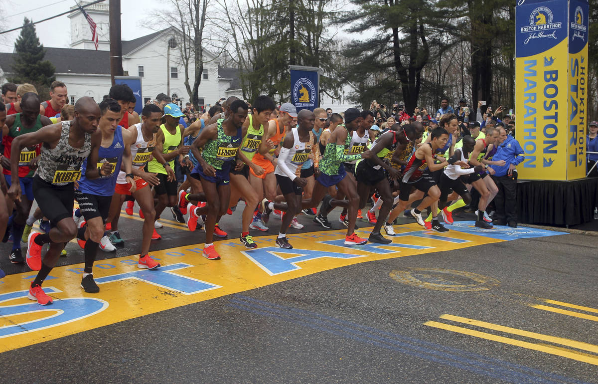 In this April 15, 2019, file photo, the elite men break from the start of the 123rd Boston Mara ...