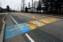 In this Monday April 20, 2020 file photo, the Boston Marathon start line in Hopkinton, Mass., i ...