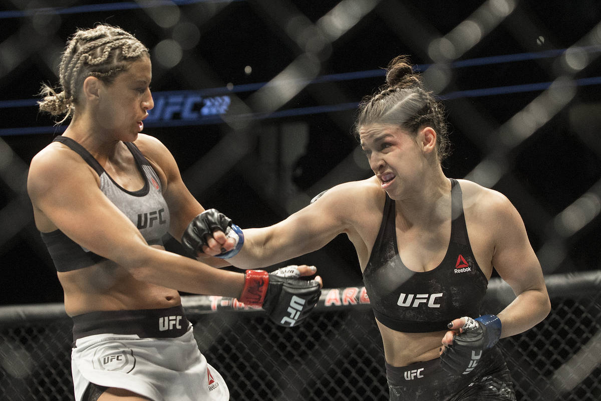 Mackenzie Dern, right, connects with a right hook against Ashley Yoder during their strawweight ...