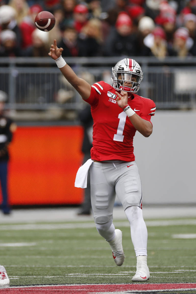 Ohio State quarterback Justin Fields throws a pass against Maryland during the first half of an ...