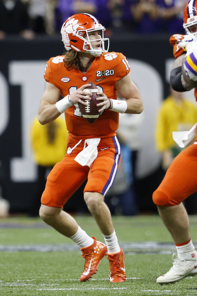 Clemson quarterback Trevor Lawrence looks to pass against LSU during the first half of a NCAA C ...