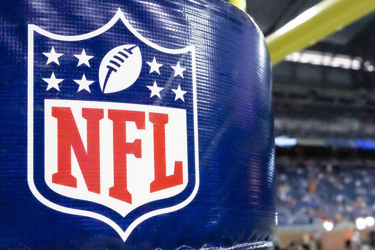 This Aug. 9, 2014 file photo shows an NFL logo on a goal post pad before a preseason NFL footba ...