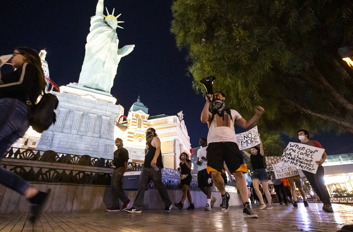 Demonstrators march to demand justice for George Floyd along the Las Vegas Strip on Thursday, M ...