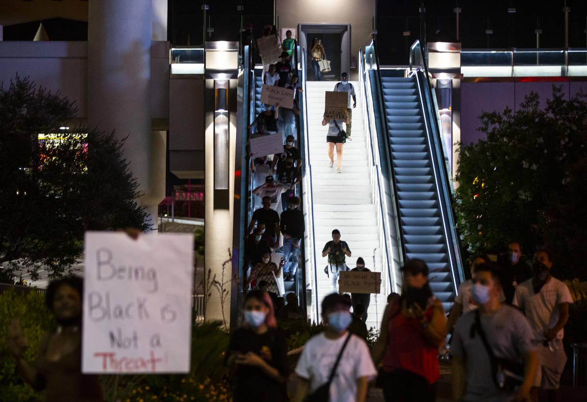 Demonstrators march to demand justice for George Floyd along the Las Vegas Strip on Thursday, M ...