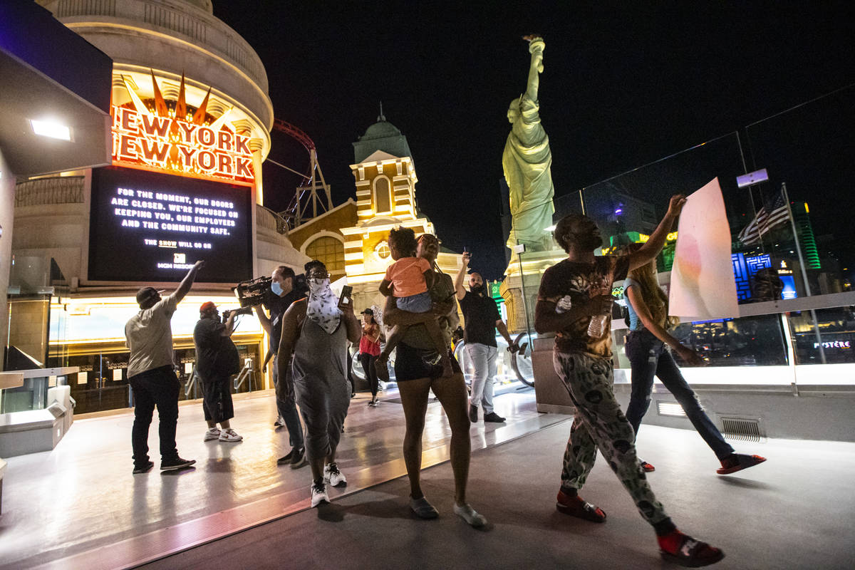 Demonstrators march to demand justice for George Floyd along the Las Vegas Strip on Thursday, M ...